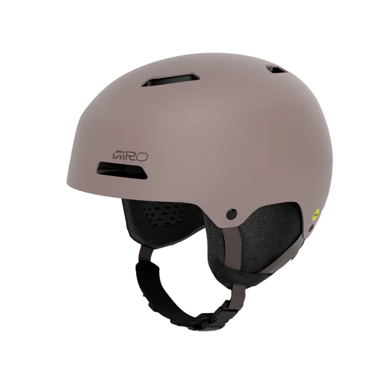A matte taupe ski helmet with black ventilation slots, black interior padding, and a black chin strap, shown on a light gray background.